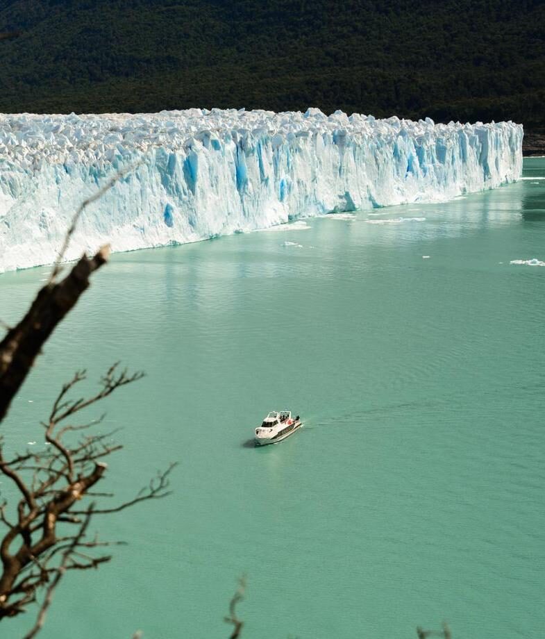 Our Jacada team trying on Carnival costumes in Brazil and a yacht cruising the Perito Moreno Glacier in Patagonia.