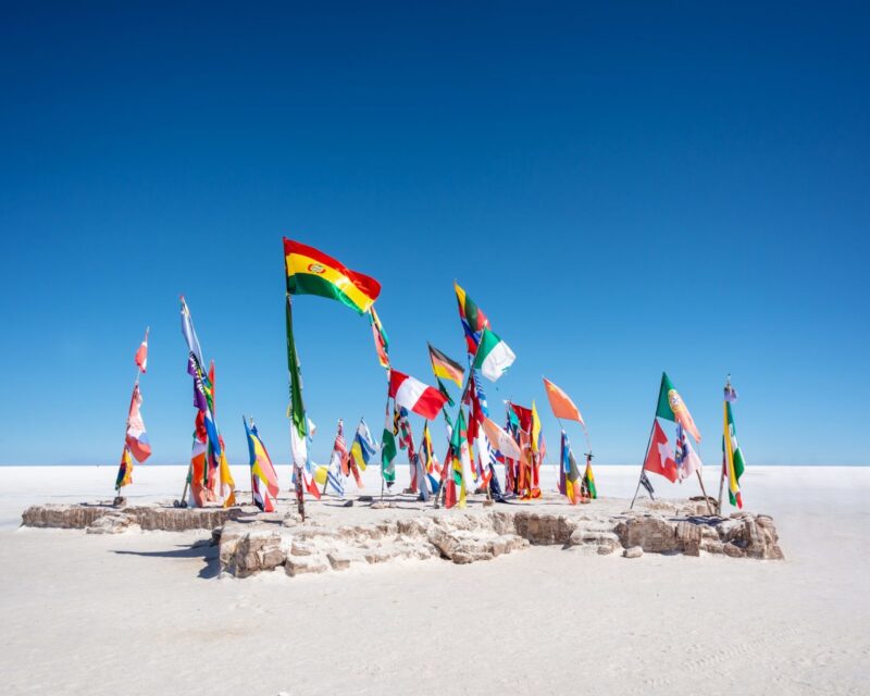 AdobeStock_N6Hr1J.jpg uyuni, salar, salar de uyuni, flags, banners, colors, colorful, world, countries, nations, national, visitors, travel, adventure, tourism, salt flat, salt, lake, bolivia, potosi, dry, altiplano, landscape, space, view, nature, destination, attraction, landmark, scene, scenery, scenic, andes, mountain, range, andean, cordillera, natural, bolivian, south america, peace, freedom, south american, potosi, province, unesco, world heritage, site, desert, playa blanca, hotel Colorful Flags From All Over the World at Uyuni Salt Flats, Bolivia, South America Uyuni salt flats