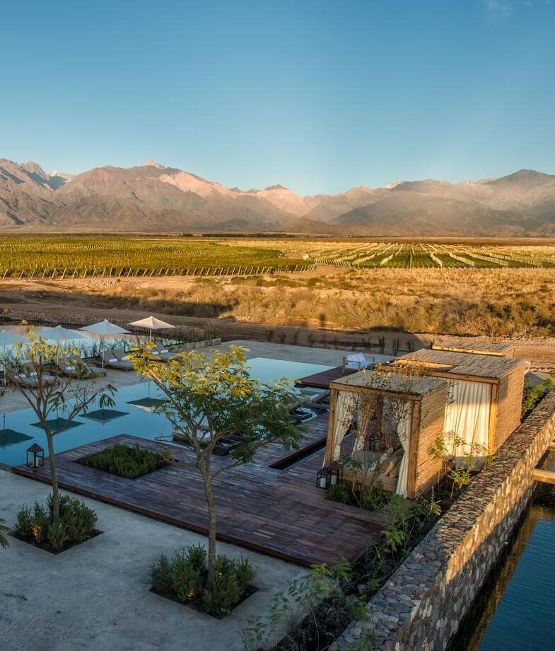 The gorgeous sunlit vineyards at the foot of the Andes surrounding The Vines Resort & Spa, and the elegant cellar of SB Winemakers House & Spa Suites celebrating Argentina’s rich wine heritage.