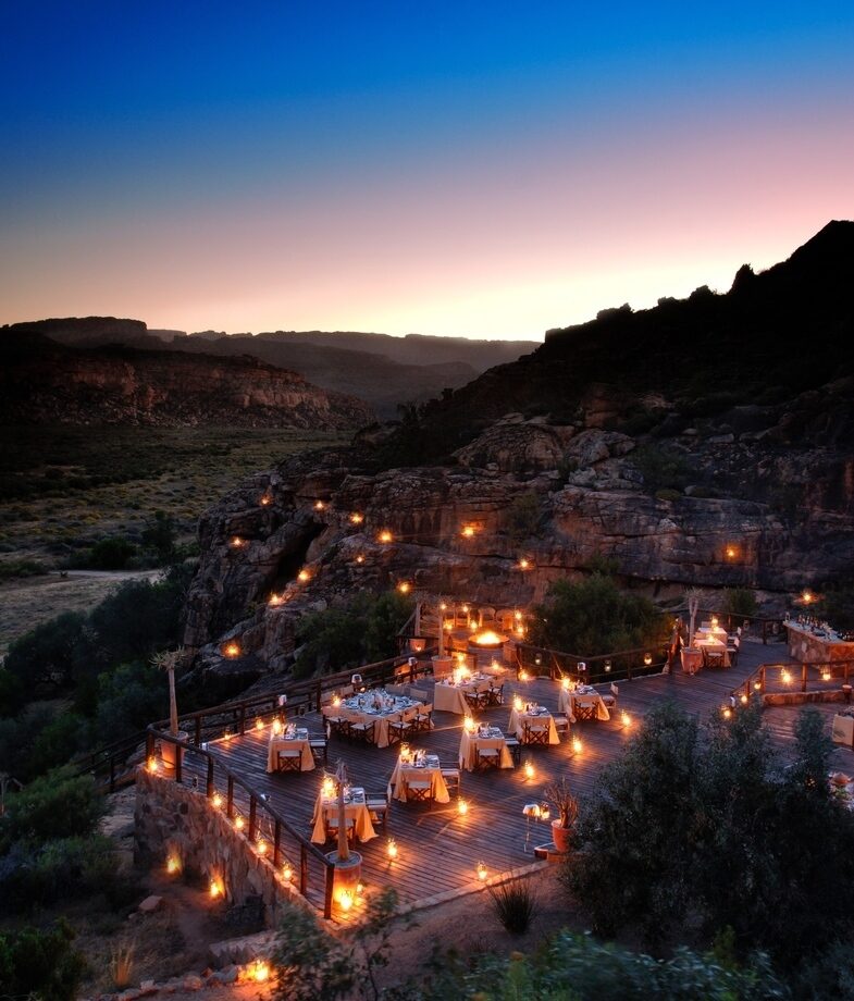 The clifftop pool suites of Six Senses Zil Pasyon in the Seychelles and the lantern-lit restaurant of Bushmans Kloof Main Lodge in South Africa.