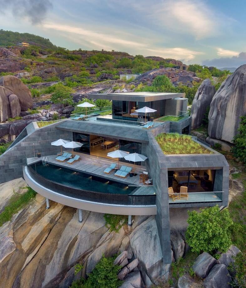 The clifftop pool suites of Six Senses Zil Pasyon in the Seychelles and the lantern-lit restaurant of Bushmans Kloof Main Lodge in South Africa.