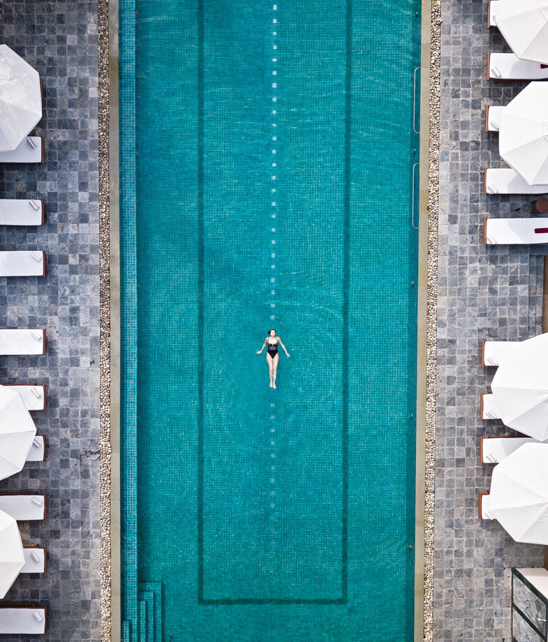 The cultivated gardens of Leeu Estates in South Africa, where the local Pinotage grape becomes a wellness ritual as well as a dining ingredient, and the expansive pool of Ananda in the Himalayas in India.