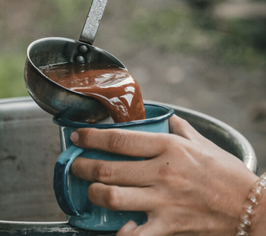 Preparing warm ceremonial cacao as you come together in shared connection