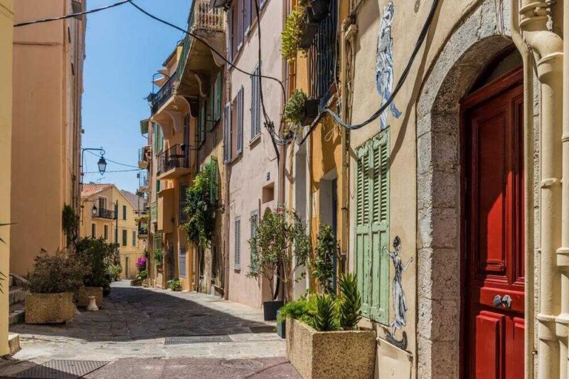 A typical view in Cannes in France alley, architecture, azur, building, cannes, city, cote, cote d azur, cote dazur, culture, destination, europe, european, exterior, france, french, historic, life, mediterranean, narrow, old, outdoors, outside, passage, people, picturesque, place, provence, riviera, road, scene, scenic, sightseeing, south, street, structure, summer, tourism, tourist, town, traditional, transportation, travel, trip, urban, vacation, view, old town Cannes France. June 15 2019. A street scene in the Old Town in Cannes in France