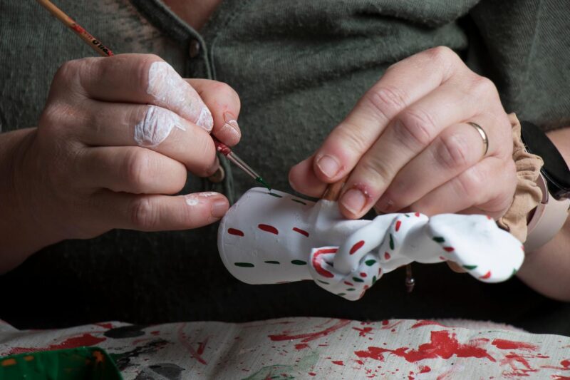 The hands of a craftswoman elaborating a traditional and ancestral figure of clay craftsmanship in Mallorca (Spain) called "siurell"