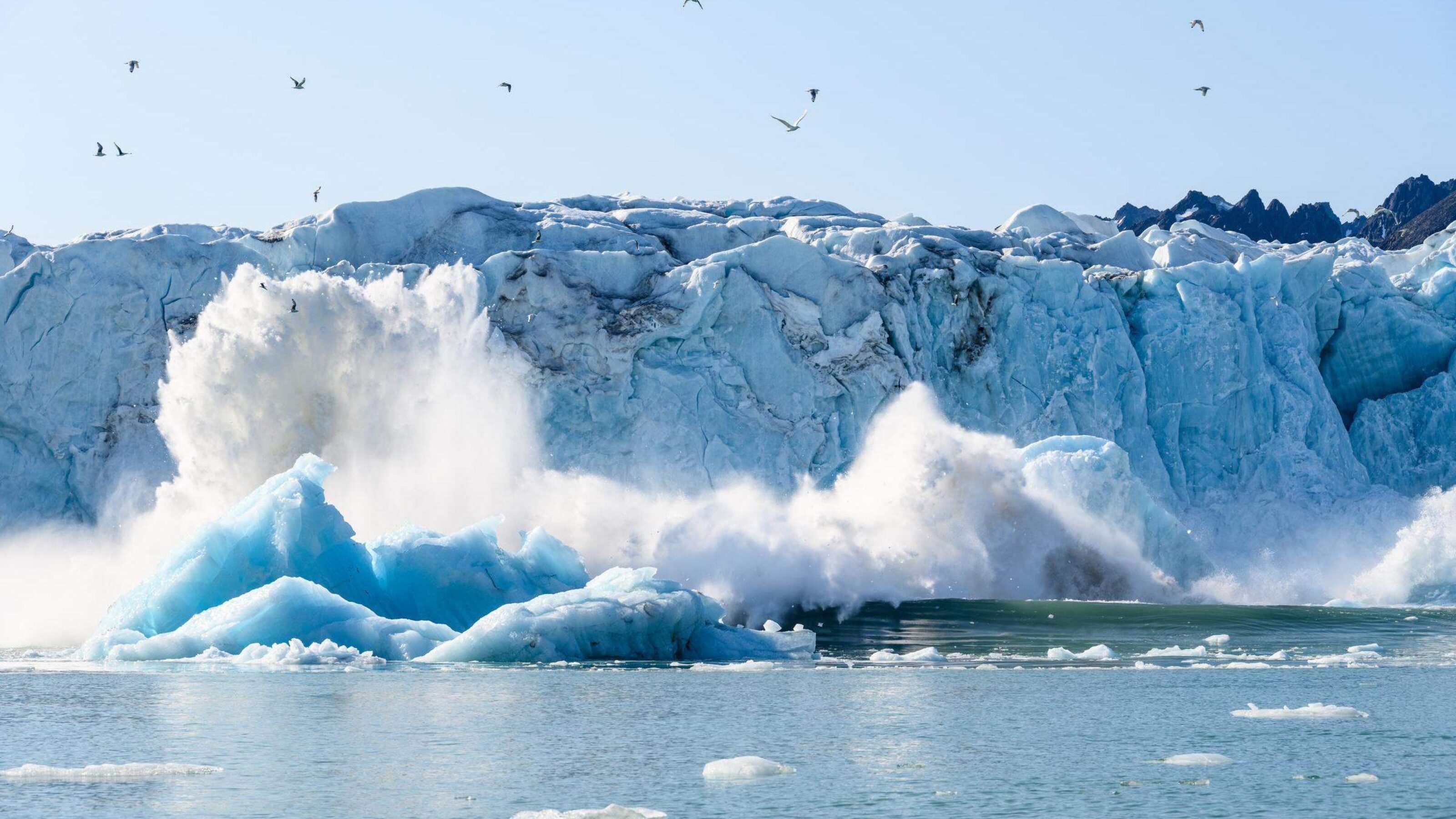 A glacier calving in the Arctic.