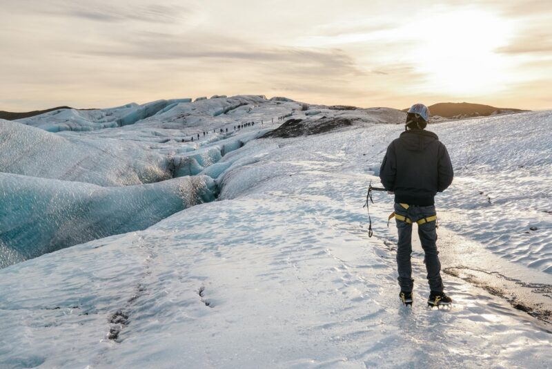 A lone explorer walks on the massive ice sheet in the Norwegian-fjords