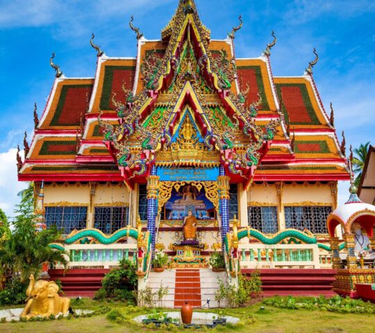Visit an ornate island temple with its carved details and peaceful courtyards
