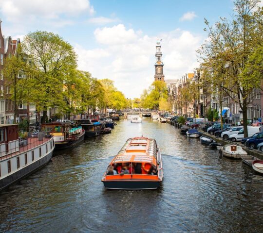 Embark on a boat cruise along Amsterdam’s canals