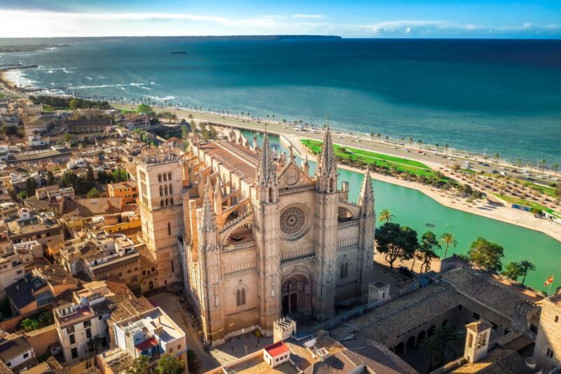 Aerial view of Palma de Mallorca cathedral next to the ocean