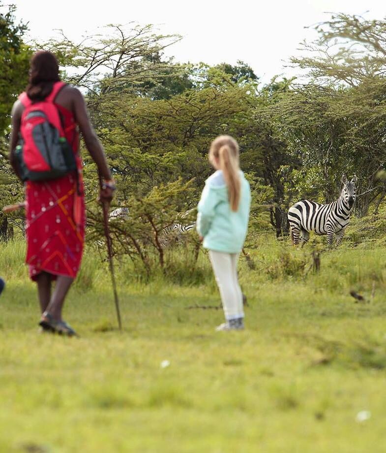 Experience a Maasai-led walking safari at Angama Mara, and relax at the Saabab massage spot with far-reaching savannah views.