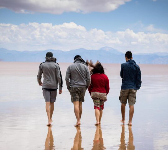 Walk the vast salt flats with your loved ones, a natural mirror