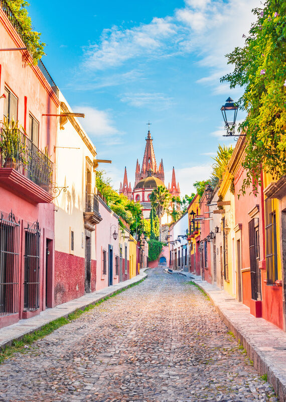 Street leading to the tall pink church in San Miguel de Allende, Mexico.