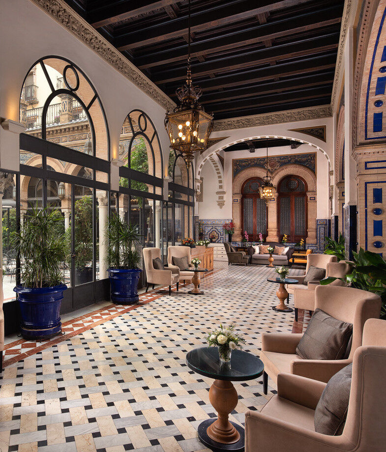 The outdoor kids’ club at Marbella Club Hotel and the elegant lounge area of Hotel Alfonso XIII showcasing its traditional Mudéjar architecture.
