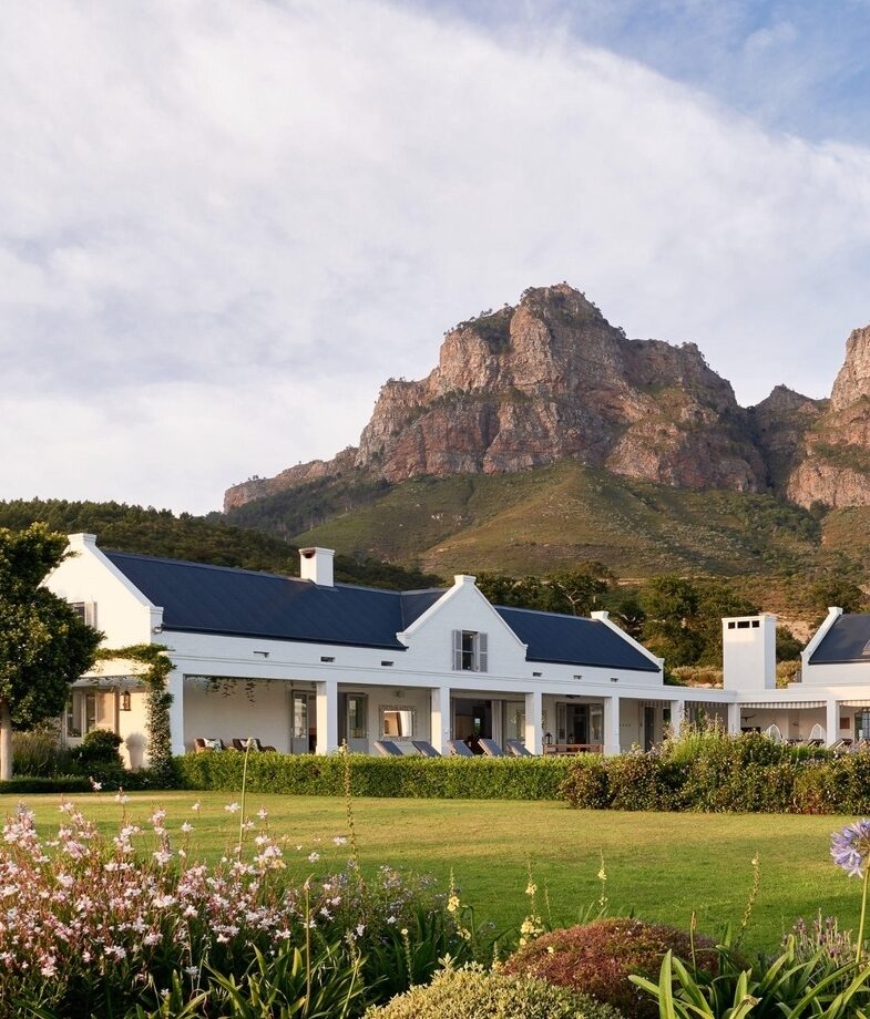 Grootbos Garden Lodge looking out over the landscape above Walker Bay, and the exclusive mountain villa at Boschendal set beneath dramatic peaks in the Franschhoek Valley.