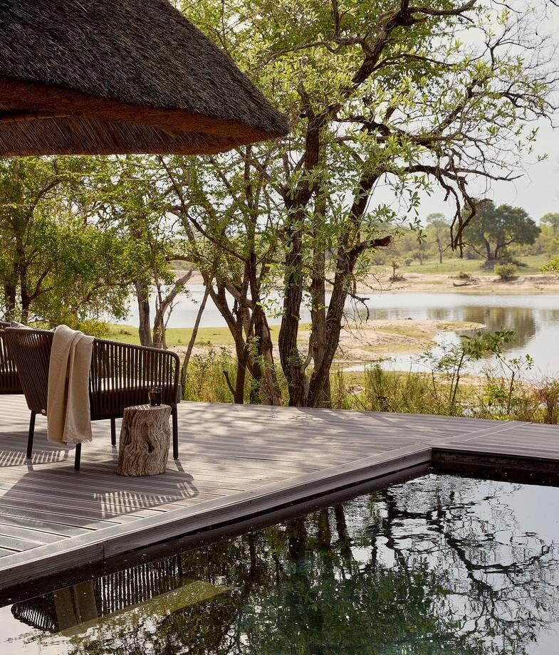 The light-filled lounge opening onto the bush at Lion Sands River Lodge, and one of the river-facing plunge pool decks at Chitwa Chitwa.