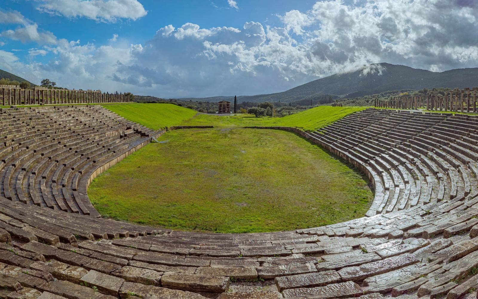 Tracing the footsteps of ancient athletes at the Stadium of Olympia in Greece, often explored over a couple of hours alongside the Temple of Zeus and Temple of Hera in the wider archaeological site.