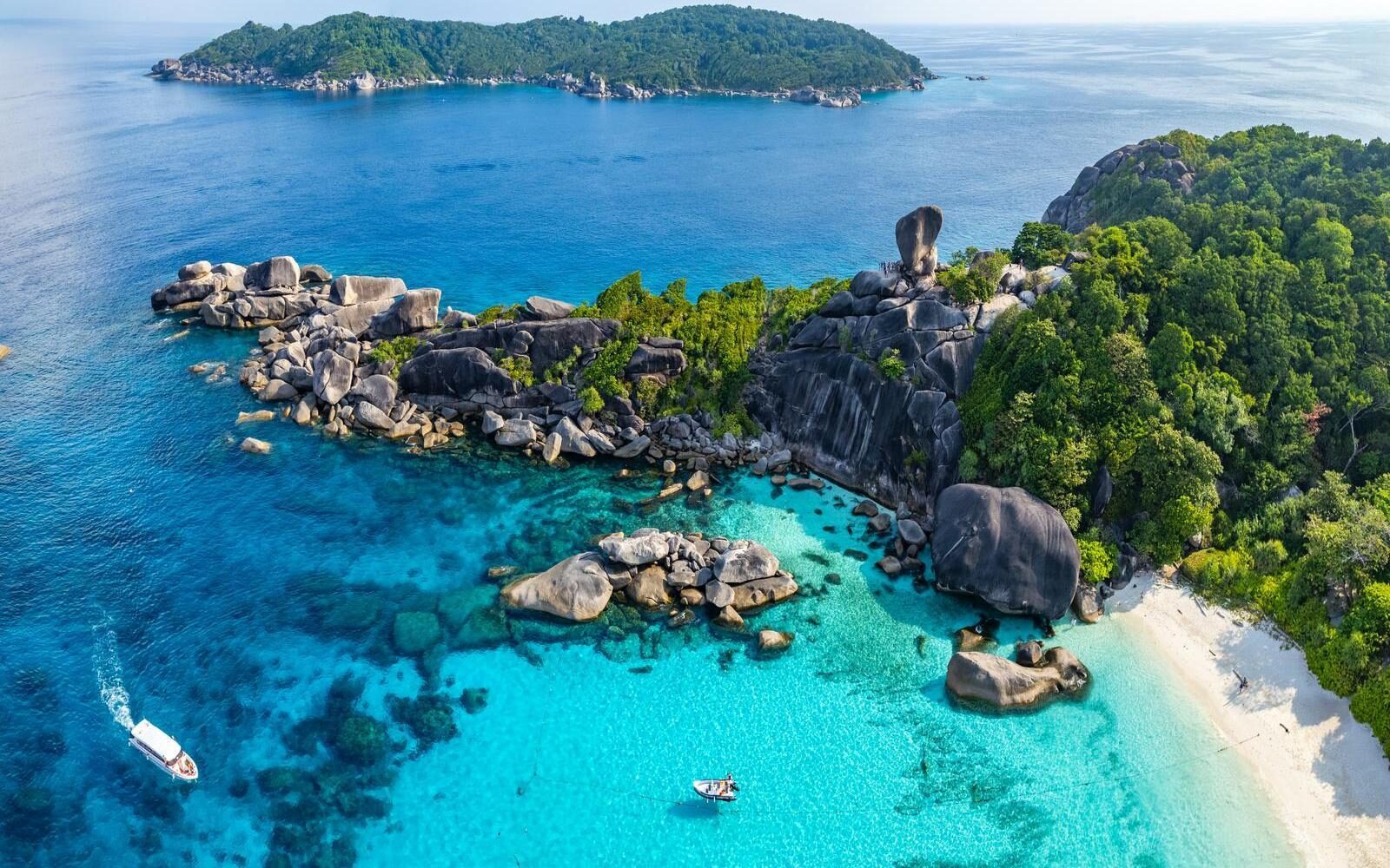 On Thailand’s Andaman coast near Phang Nga, this is a great stop for clear water, granite boulders and snorkelling straight off the boat.