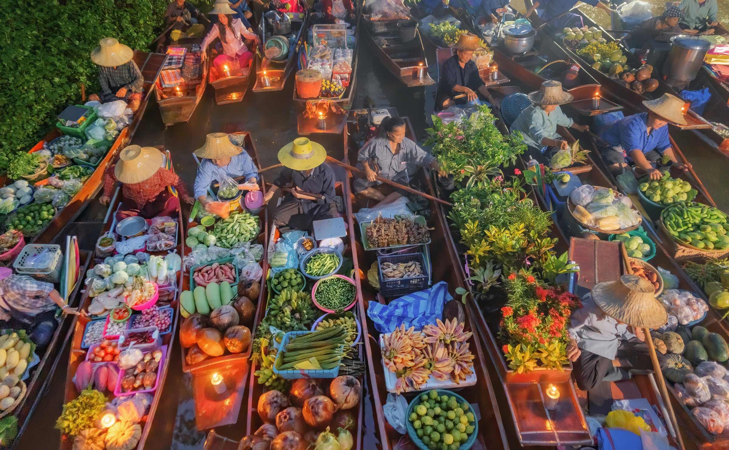 aerial view of people selling fresh fruit and vegetables at Damnoen Saduak Floating Market