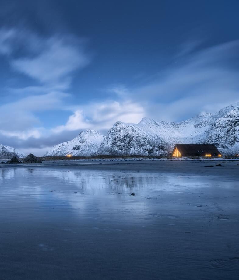 Experience Norway’s blue hour as the Arctic coast settles into twilight and warm lights glow beneath snow-covered peaks. Spot jaguars along Brazil’s Pantanal waterways, where cubs stay with their mothers for around 18 months.