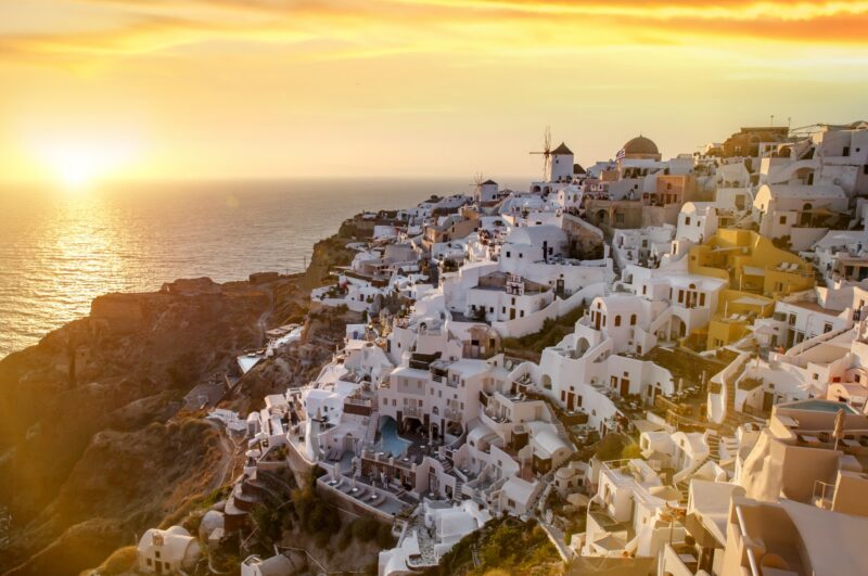 Impressive evening view of Santorini island. Picturesque sunset on the famous Greek resort Oia, Greece, Europe.